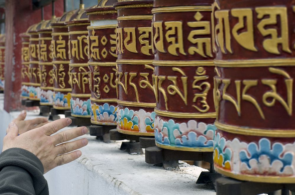 The great mantra of Tibetan Vajrayana Om mani padme hum inscribed on prayer wheels
