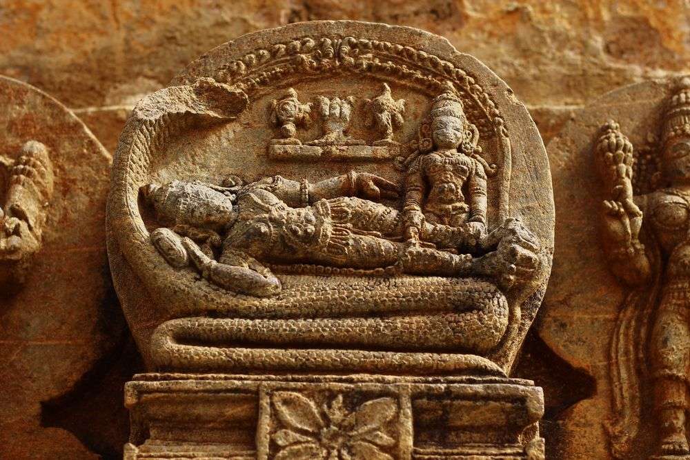 Ranganathaswamy: Vishnu reclining on the huge coils of Adishesha with seven-hooded head. Temple in Srirangapatna.