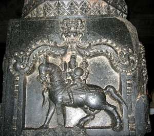 Hampi's Hazara Rama Temple: Sculpture of Kalki holding in his four hands sankha, chakra, sword, and shield and riding a horse